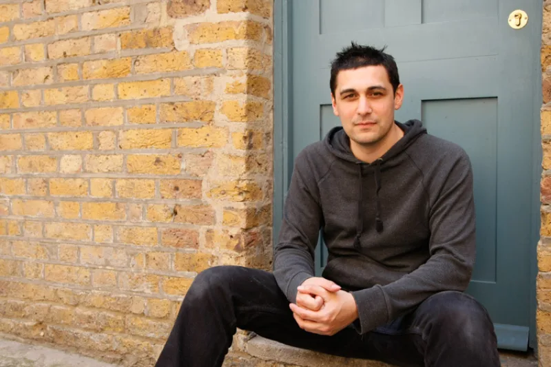 Headshot of author Adam Rutherford