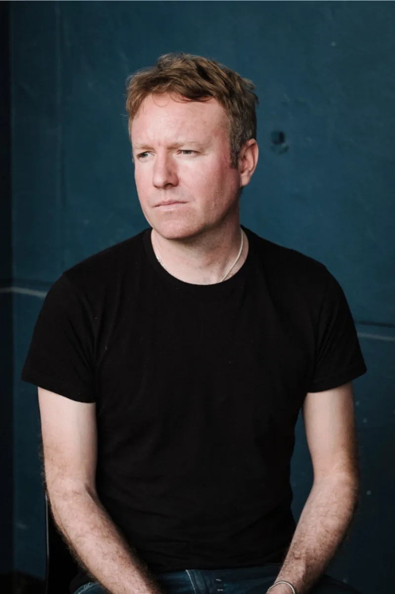 Headshot of author Joe Thomas