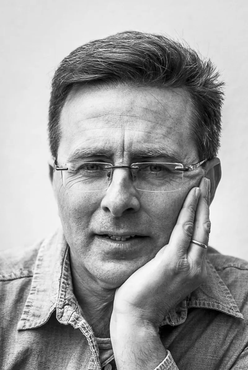 Headshot of author J.S. Monroe
