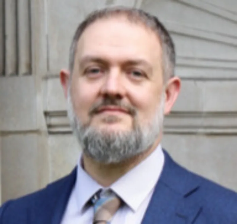 Headshot of author Dr Mark Freestone