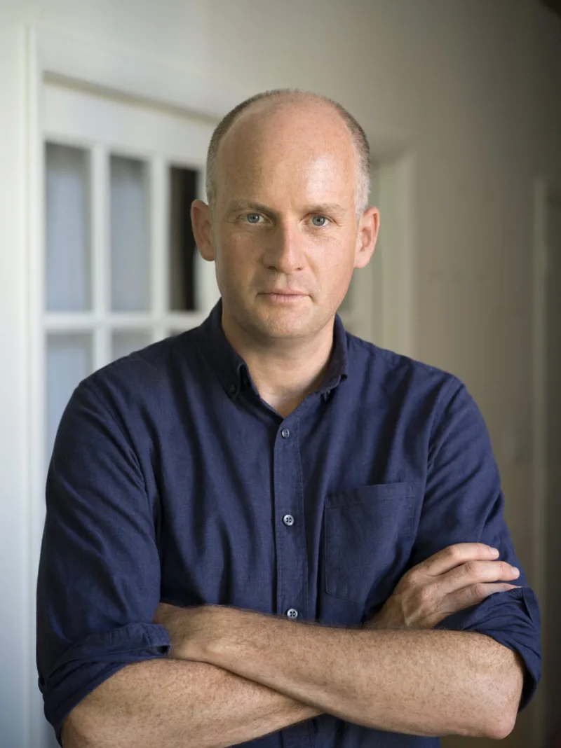 Headshot of author Oliver Burkeman